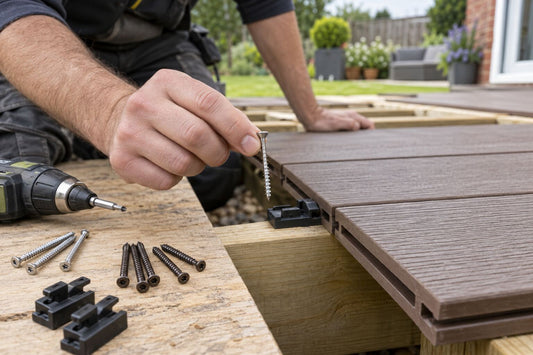Installer comparing corrosion-resistant screws and hidden clips for composite decking.